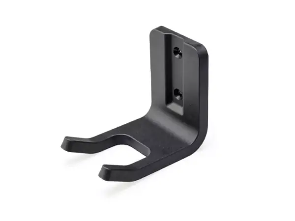 Nástěnný držák pro akumulátorový povrchový kartáč Einhell PICOBELLA 18/90 na bílém pozadí.