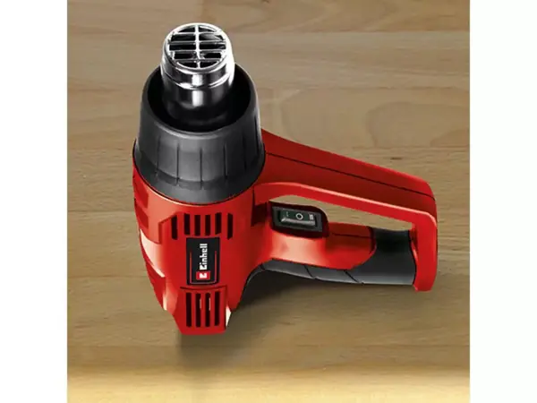 Odkládací plocha horkovzdušné pistole Einhell TH-HA 2000/1 pro stacionární použití na dřevěné podložce.